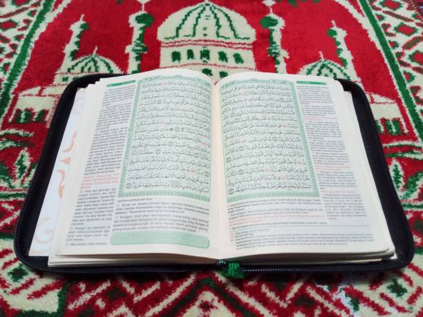 istock Al-Quran and prayer mat 2165038913