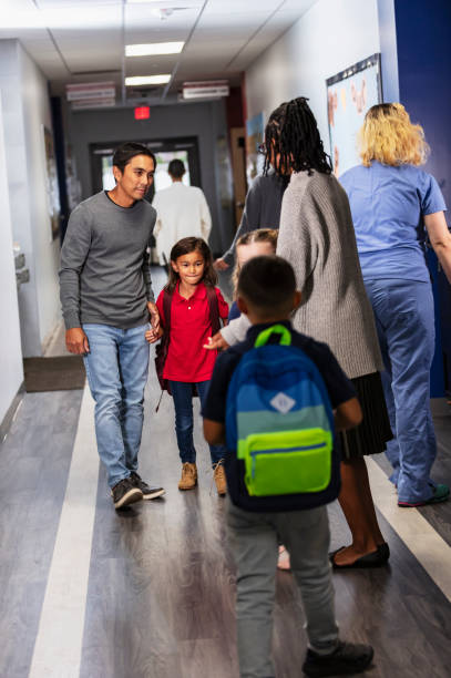 istock Asian father dropping daughter off at elementary school 2165040756