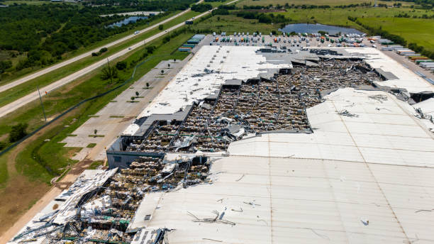 istock Tornado aftermath devastates warehouse in Oklahoma. Extensive roof damage in Oklahoma surroundings 2165040793