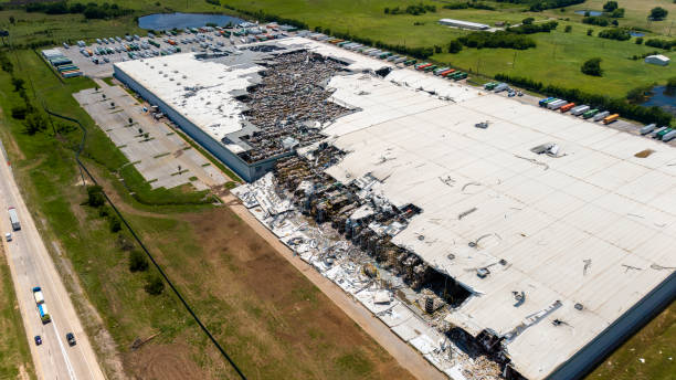 Warehouse devastated by tornado. Severe damage to industrial building in rural Oklahoma