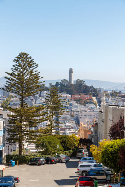 San Francisco, CA, USA -September 16, 2014:  A typical steep hill and the Coit Tower on Telegraph Hill in the background, San Francisco, California.