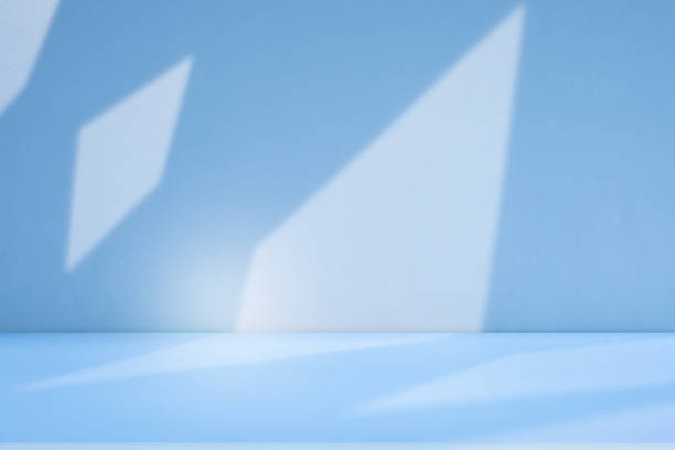 istock Studio style background wall decoration presentation uses white and blue tones. with shadows cast from a nearby window, concept creating a decorative 2165048249