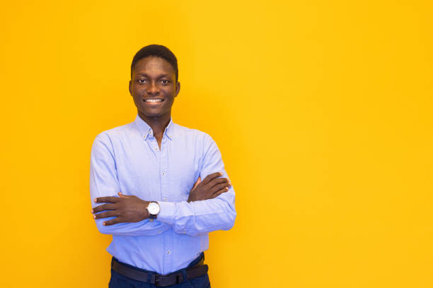 istock Confidence young man on the yellow background 2165051565