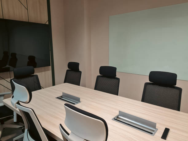 istock Empty small meeting room with television and white board for discussion. Modern minimalist interior room. 2165054185