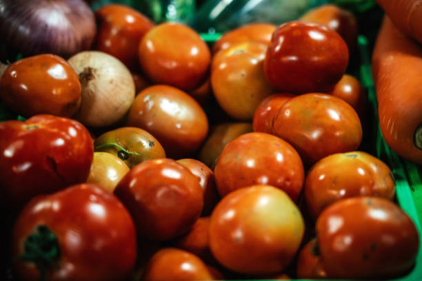 Fresh red tomatoes for sale at farmers market