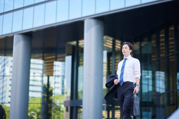 istock Young businessman in a suit leaving the office 2165054761