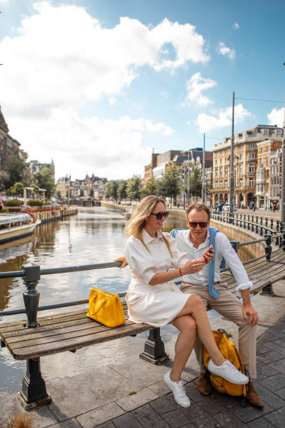 A middle aged couple sightseeing in Amsterdam