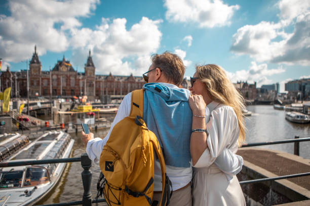 A middle aged couple sightseeing in Amsterdam