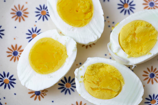 istock Isolated hard-boiled chicken eggs in cross section, top view 2165060157