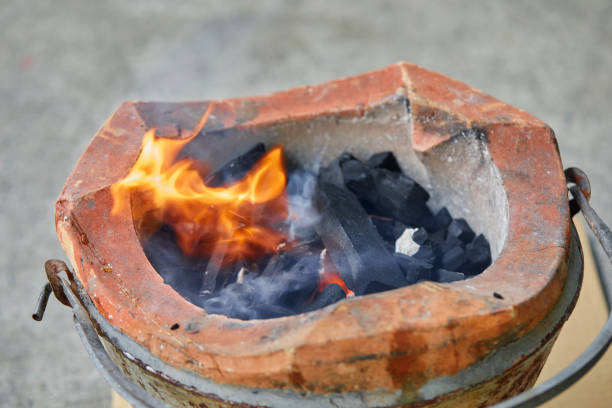 Close-up view of fire in charcoal stove