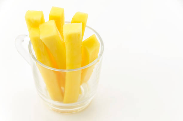 Sliced pineapple core packaged in transparent glass cup