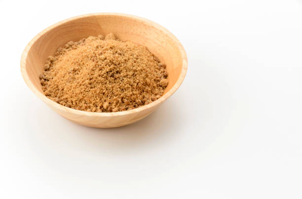 istock Powdered brown sugar with wooden bowl 2165061440