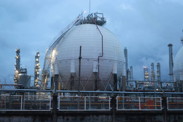 istock Gas storage sphere tanks in factories on a sunset blue sky background 2165061773