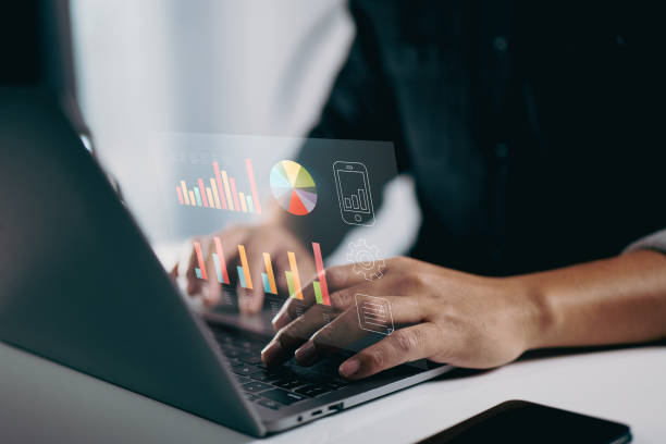 istock person typing on a laptop with floating data charts and graphs. It represents the use of digital tools for data analysis, business intelligence, and visualizing metrics to support decision-making. 2165063291