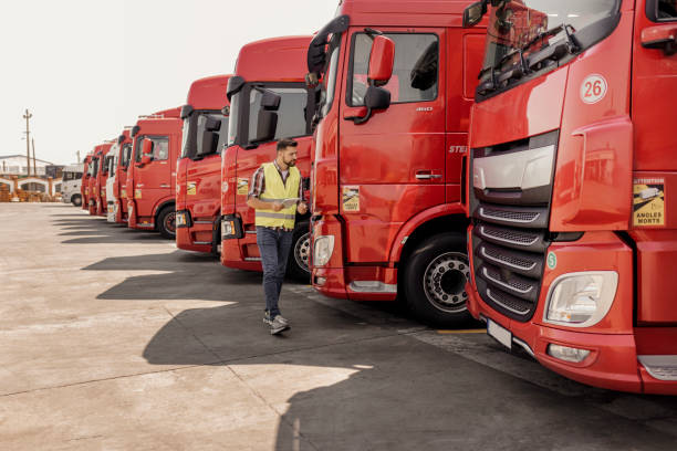 istock Truck Driver With Digital Tablet Checking the Truck 2165069688