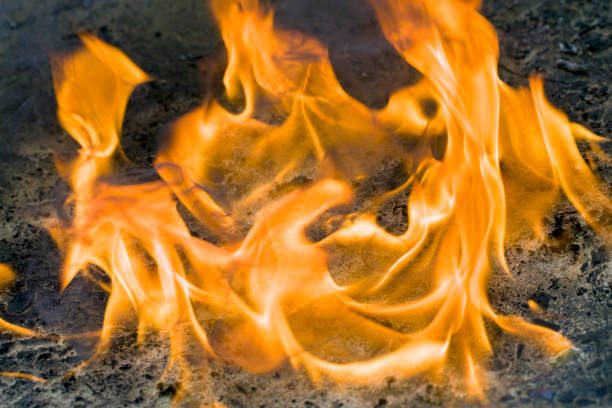 The flames of the fire create silhouettes in the darkness, silhouettes of spirits, demons, people, fire is heat and energy