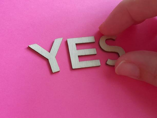 istock Yes subtitle with hand and pink background 2165072491