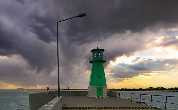 istock Vintage lighthouse on the background of the sunset sky 2165073764