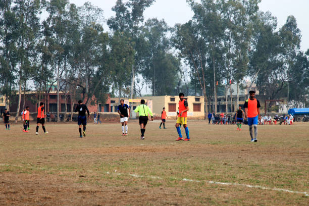 Rohtak, Haryana, India – Feb 12, 2018: Local teams playing football game together in playground.