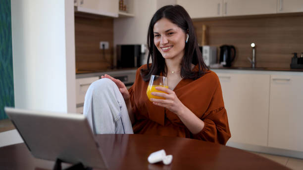 istock Woman watching a fun show on a tablet 2165079765