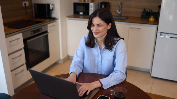 istock Young woman working online on her laptop 2165080745