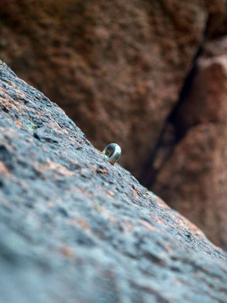 istock Climbing piton (also called pin or peg). Equipment for rock wall climbing. 2165086995