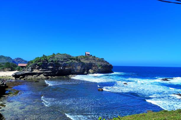 Very beautiful view of blue ocean and coral rocks on Bercak Beach, Pacitan, East Java.
