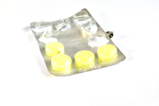 Close-up of an incomplete package of medicine to treat a throat.