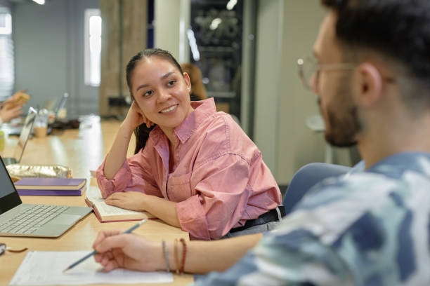 istock Young Happy College Student Chatting with Classmate 2165091335