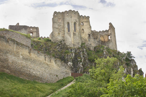 Beckov, Slovakia - June 9: The ancient 12th century Beckov Castle in Slovakia. Landscape with a medieval castle on top of a mountain  June 9, 2023 in Beckov, Slovakia