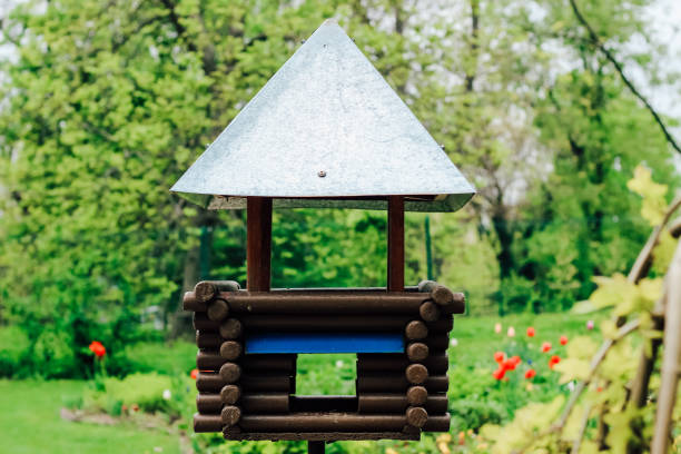 wooden bird feeder with a roof