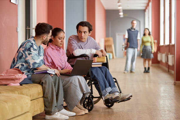 istock Young Thoughtful Students Having Discussion in University Hallway 2165092685