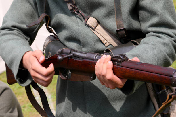 istock Italian WWI soldier loading an antique rifle 2165101412