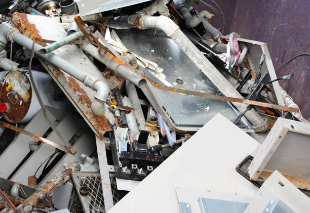 istock Scrap metal and twisted sheets in a recycling center container 2165102986