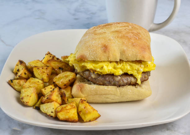 istock scramble egg  with sausage patty on brioche  bun 2165110011