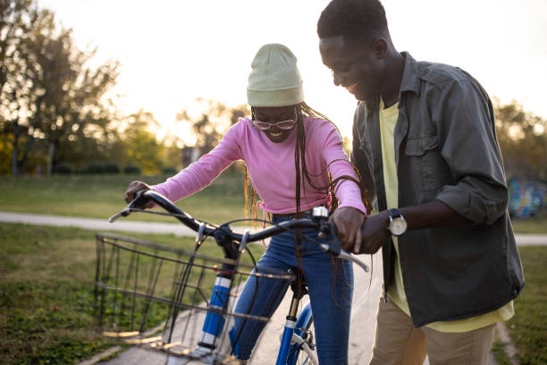 istock Woman Learning to Ride a Bicycle 2165121758