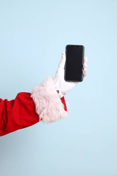 istock Santa holding mobile phone 2165122033