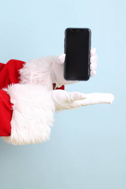 istock Santa holding mobile phone 2165122058
