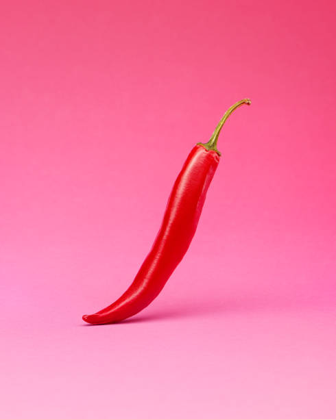 istock Hot red chili pepper on pink background 2165122692