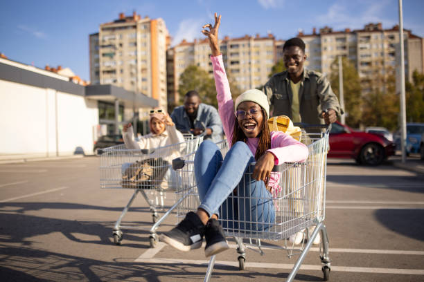 istock Couples racing with shopping carts 2165123101