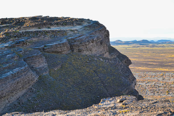 Lone tree on a cinder cone volcanic rock formation in Craters of the Moon National Monument in Idaho