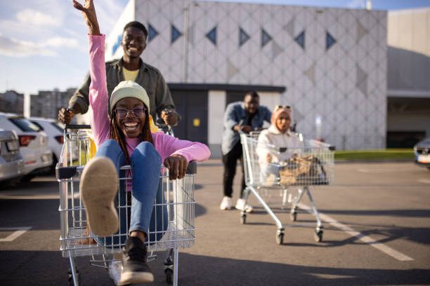 istock Couples racing with shopping carts 2165123337