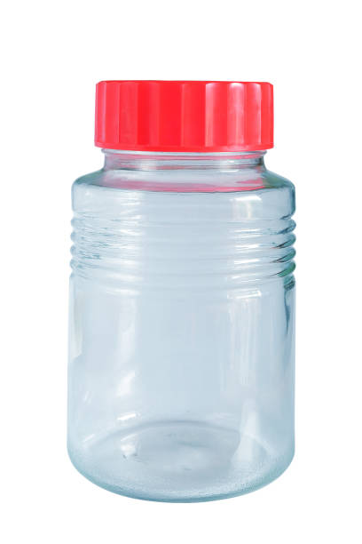 istock Empty glass jar with red cap isolated on white background. 2165123430