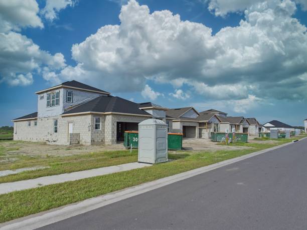 istock Florida residential street with new homes lined up under construction 2165124980