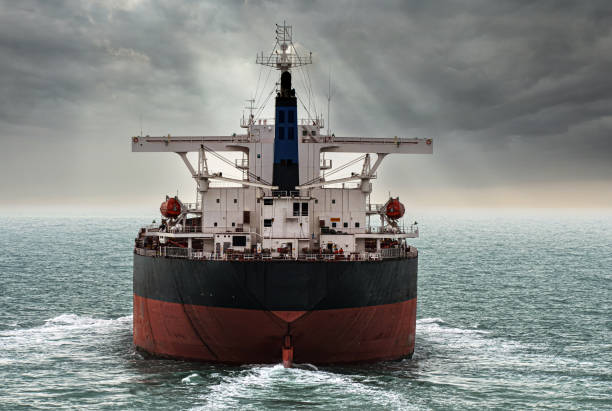 istock Cargo ship in aerial view under beautiful cloudy sky 2165128191