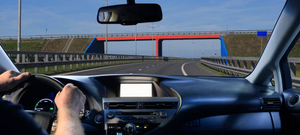 istock View from a moving car of a road 2165128197