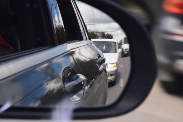 istock cars in the mirror 2165129349