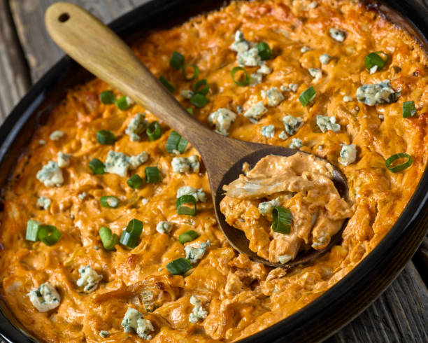 istock hot buffalo chicken dip in baking dish, top view 2165129602