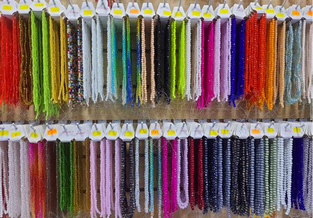 istock Semi-precious stone beads hanging in a row.. 2165130375