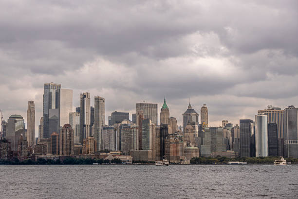 istock Mid Manhattan skyline under gray cloudscape, New York, NY, USA 2165130770